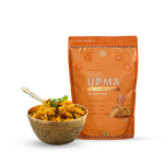 An orange stand-up pouch of Pearl UPMA gluten free breakfast mix displayed next to a decorative gold-toned bowl filled with cooked upma and garnished with cilantro, on a clean white background.